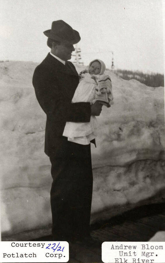 A photograph of Andrew Bloom, unit manager at Elk River, with a child.