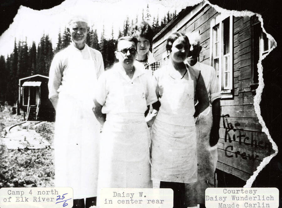 A photograph of the kitchen crew of camp 4 north of Elk River. Daisy Wunderlich in center rear.