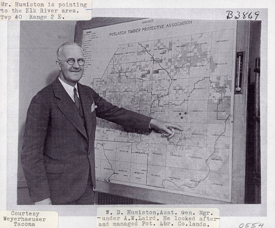 A photograph of A.W. Laird's Assistant General Manager W.D. Humiston who looked after and managed the lands of Potlatch Lumber Company. He is pointing to the Elk River area.