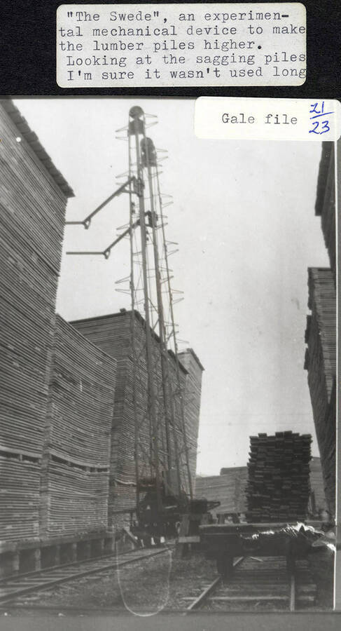 A photograph of an experimental mechanical device used to increase the height of the piles of lumber called 'The Swede.' It does not appear to do a good job.
