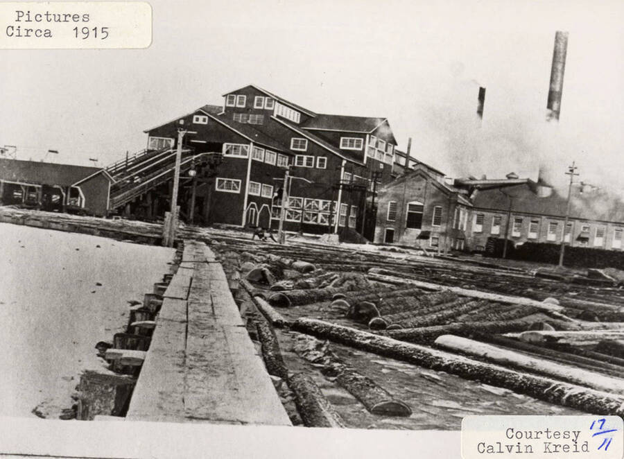 A photograph of the log pond, log slip, and the mill at Potlatch.