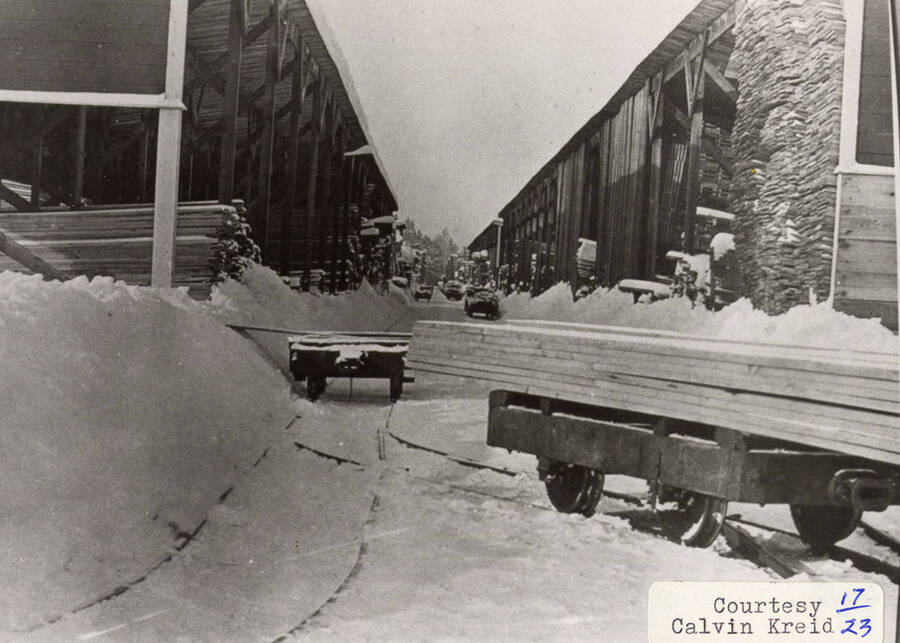 A photograph of the lumber yard covered in snow.