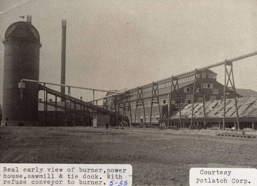 An early photograph of the burner, power house, sawmill, tie dock, and refuse conveyor to burner.