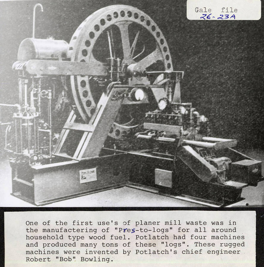 A photograph of one of the four machines used to produce 'Pres-to-logs' as a household type wood fuel. It was invented by chief engineer Robert 'Bob' Bowling and used planer mill waste.
