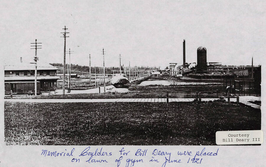A photograph of the memorial boulders for Bill Deary that were placed on the gym lawn in 1921.