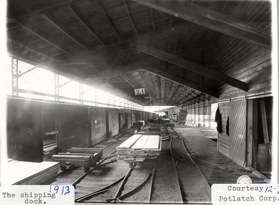 A photograph of the interior of the shipping dock at Potlatch Lumber Company.