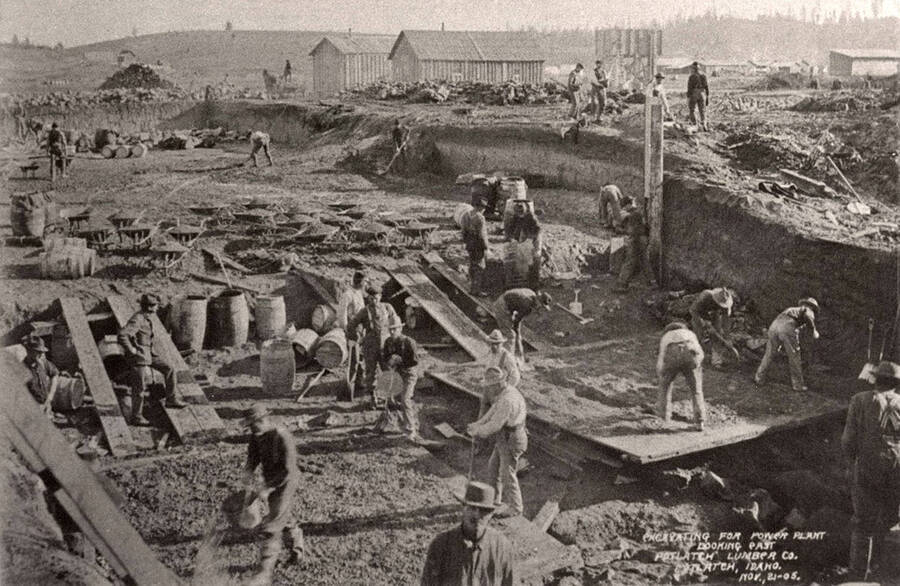 A photograph of workers excavating land for the power plant for the Potlatch Lumber Company.