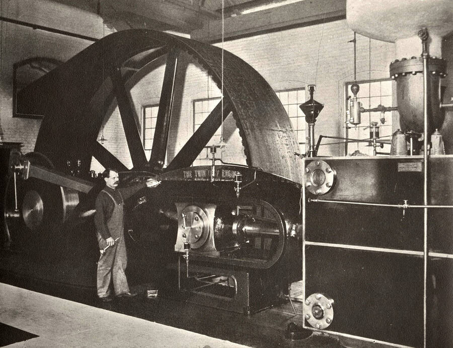 A photograph of an employee with the Twin City Engine.