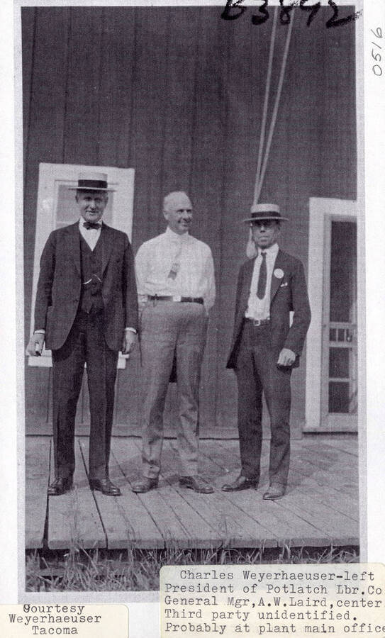 A photograph at the plant main office of Charles Weyerehaeuser, President of Potlatch Lumber Company, and Gerneral Manager A.W. Laird with an unidentified third party.