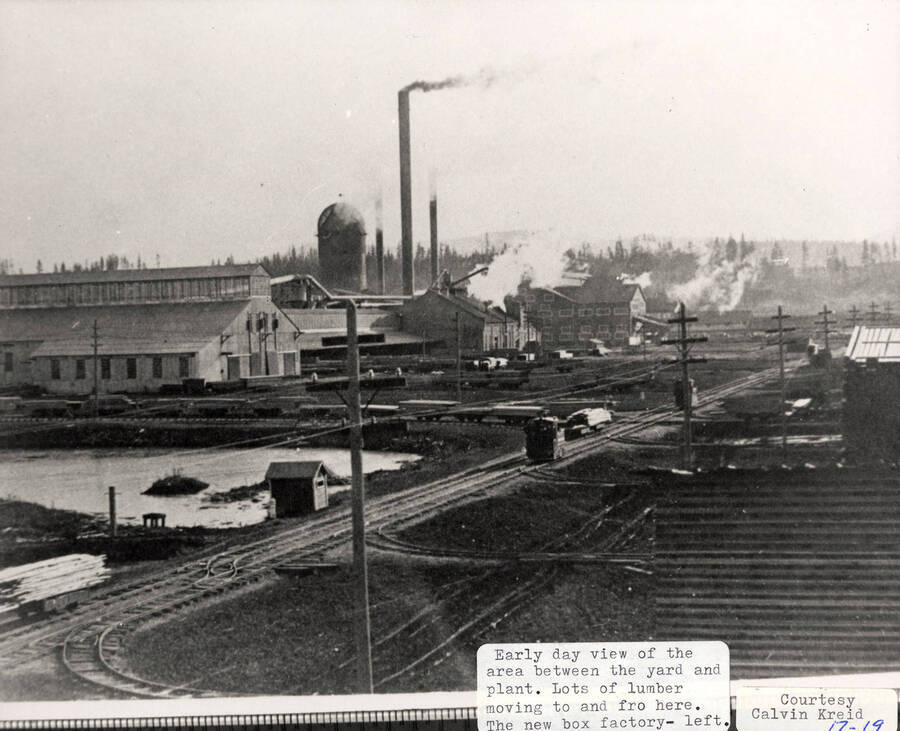 A photograph of the area between the lumber yard and plant where a lot of lumber moved through. The box factory is to the left.