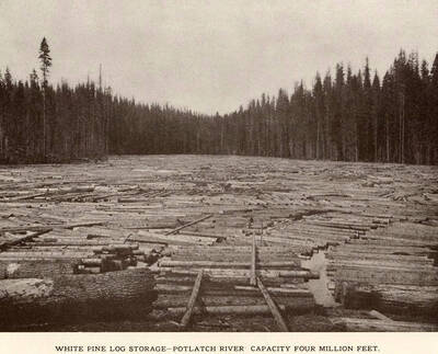 A photograph taken on the Potlatch River of the white pine log storage area that had a capacity of four million feet.
