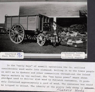 A photograph of Florence Woods and a 'two horse power' wagon used to deliver slab wood to Potlatch customers. Slab wood was made of wood waste and was sold to the residents of Potlatch along with Spokane and other nearby communities.