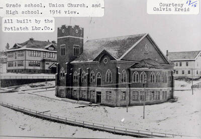 A photograph of a 1914 view of the grade school, Union church, and high school that were all built by the Potlatch Lumber Company. Photo courtesy of Calvin Kreid