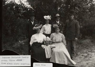 A glass plate negative photograph of an unknown Potlatch family group.