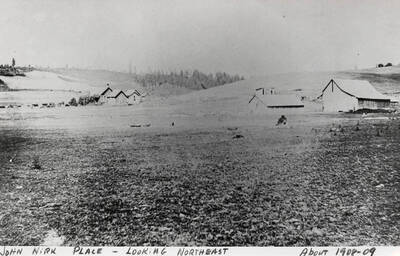 Looking Northeast across fields at the John Nirk Place. Taken around 1908 to 1909.