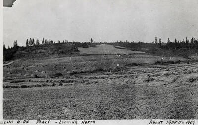 Looking North across fields at the John Nirk Place. Taken around 1908 to 1909.