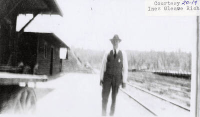 A blurry photograph of a man on a street.