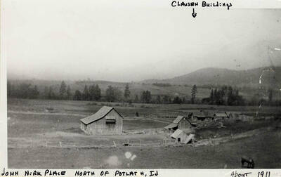 The John Nirk Place North of Potlatch, ID. The Clausen buildings are labeled with by an arrow. Taken around 1911.