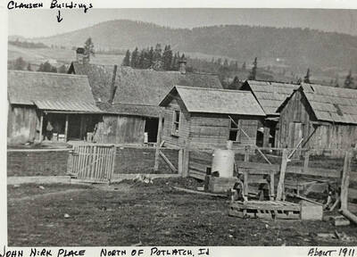 Buildings on the John Nirk Place North of Potlatch, ID. The Clausen buildings are labeled with by an arrow. Taken around 1911.