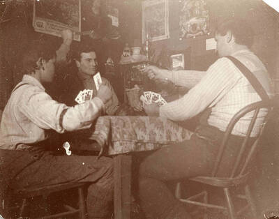 Posed photo with caption ''tough guys.'' John, Paul and August Leistner. Likely in kitchen at old Bysegger homestead.