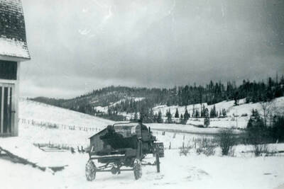Lowell Soncarty with the tractor and sister Shirley (Sissy) in the old Model-T Ford. Gathering up old junk.