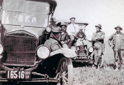 A few men sitting on the hoods of automobiles. Pictured are Mr. Nirk, Bill Leistner, Verne Clark, August Leistner, Paul Anderson, and Fritz Leistner.