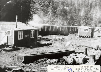 View of Camp one on Hatter Creek, which is located south of Princeton. Many buildings with 'PLC' on the side can be seen around the camp.