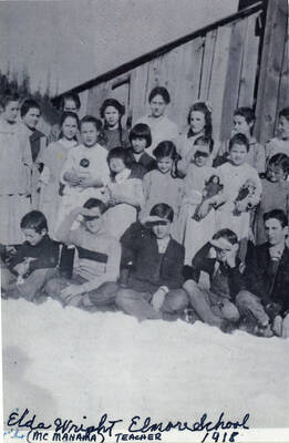 Students at the Elmore School in about 1918. Student names are included but not matched to the student: Elda Wright, Bertha Katzenberger, Vernie Nolan, Emily Swatman, Beth Katzenberger, Inez Smith, Opal Hollenbeck, Lila Nolan, Mabel Krasselt, Naoma Smith, Clara Bysegger, Albert Krasselt, Luella Hall, Edith Swatman, Wilma Nolan, Josie Smith, Doris Katzenberger, Lois Hollenbeck, Andrew Swanson, Eddy Bysegger, Vincent Katzenberger, Curtis Katzenberger.