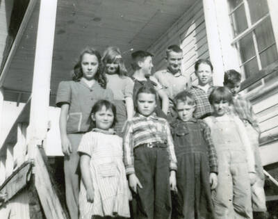 Mountain Gem School and students. Back row: Louise Frances, Patty Frances, Wayne Darby, Leroy Leveson, Gene Frances, Jim Lowe. Front row: Gracie Mitzenberg, Lolla Holmes, Phil Frances, Joanne Mitzenberg.