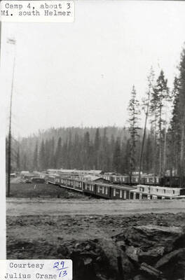 View of PLC Camp 4, which is located 3 miles south of Helmer, ID. A row of buildings can be seen on the camp.