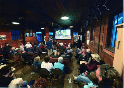 Photograph of a program in the freight room of the WI&M Railway Depot.