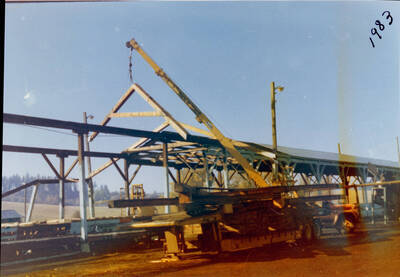 Photograph of dismantling the green chain at the Potlatch Mill.