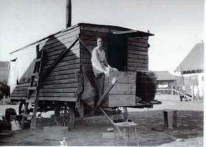 Loeona Carscallen on the steps of a cook shack during harvest.