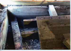 Photograph of restoring the foundation and floor of the WI&M Annex.
