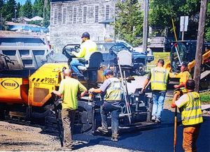 Photograph of crew paving the parking lot at the WI&M Depot in Potlatch.