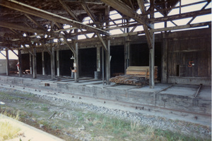 Photograph looking across green transfer pit at Kiln 5-12.