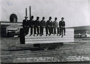Photograph of the first load of lumber at the Potlatch Mill with Mark Seymour,Sr., A.H. Irving, W.A. Wilkinson, A.W. Laird, Bill Deary, Cliff Muser, and R.M. Weyerhaeuser