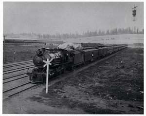 Photograph of WI&M Railway Locomotive #21 brings special train of Baron and Baroness Shibusawa of Japan into Potlatch.
