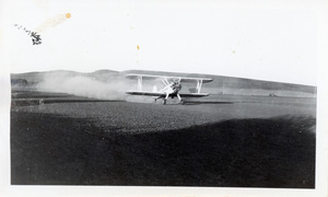 Photograph of an airplane spraying for the tussock moth.