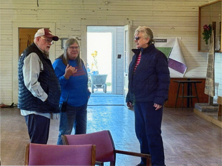 Photograph of Gary and Carolyn Strong visiting with Nancy Largent at the Mountain Home Grange.