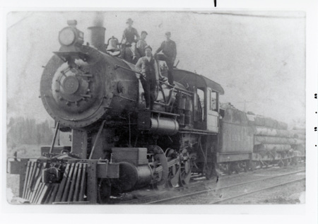 Photograph of Locomotive #22 with men on it.