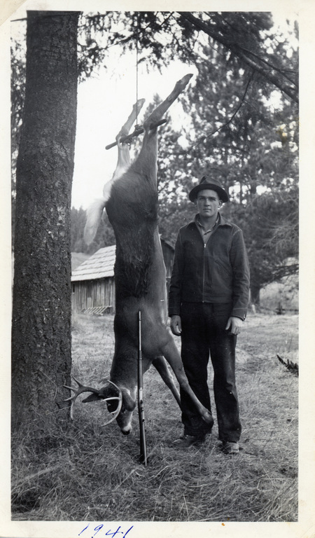 Photograph of Gerald Nirk with deer.