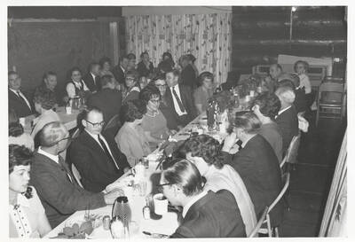 The opposite view of the guests at Lee Gale and Pedie Alsterlund's retirement party at the Log Cabin.