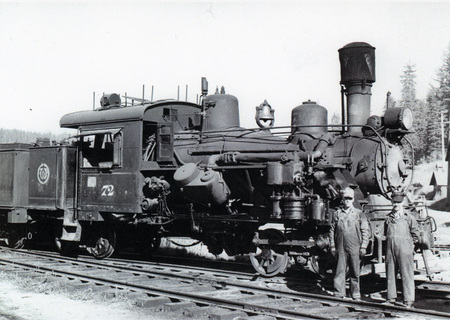 Photograph of men standing in front of Locomotive #72 at Headquarters.
