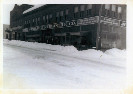 Photograph of snow in front of the Potlatch Mercantile in winter.