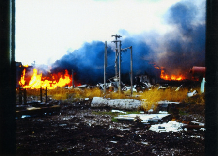 Photograph of building at the Potlatch Mill on fire.
