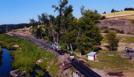 Photograph of equipment repairing the trestles on the WI&M Railway.