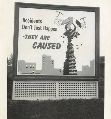 A photograph of a sign that reads, 'Accidents Don't Just Happen - They are Caused.'