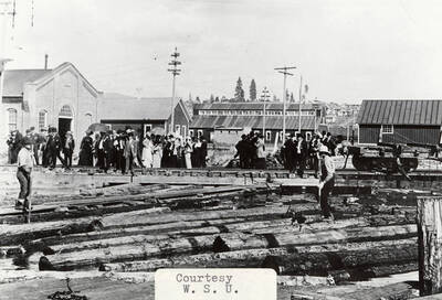 A photograph of the Japanese trade delegation at the log pond.