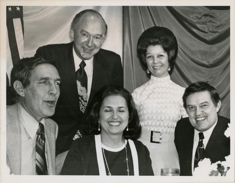 Photo Description: Stewart Udall, Governor Cecil Andrus, Bethine Church, Carol Andrus, and Senator Frank Church are all dressed up and posing for a picture at a banquet. Text back translation "Botse - Key Performers 2x3 3/5"